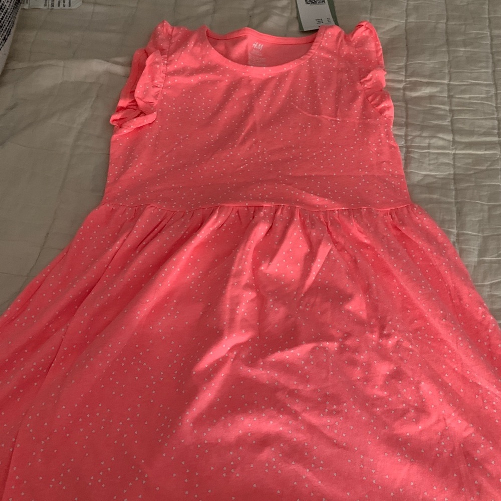 H&M dress with little white heart and beautiful sleeve details.New with tags
